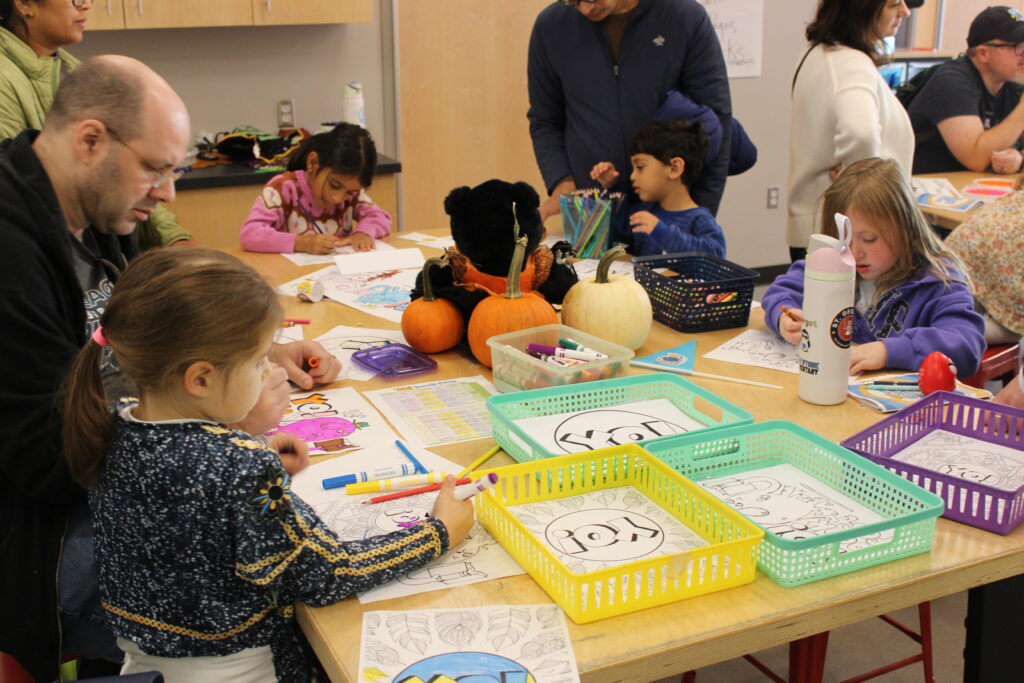A group of children completing crafts.